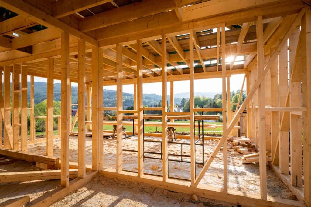 Wooden framing of a house under construction by Struxure 28 Builders.
